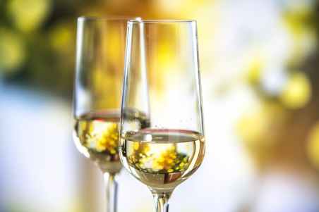 beige liquid in clear glass wine flutes